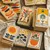 A deck of cards with sunflowers and colourful shapes on them