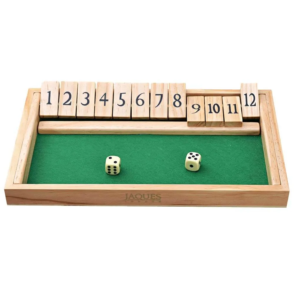 A wooden open box with a felt green base with two dice in it with wooden numbers 1 to 10